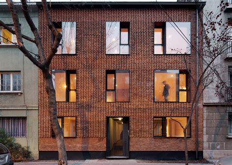 mapa updates chilean housing block with textured brick facade
