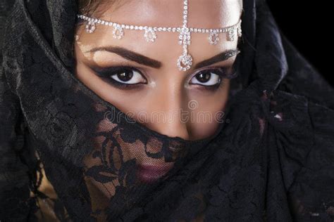 beautiful woman in middle eastern niqab veil on isolated black b stock