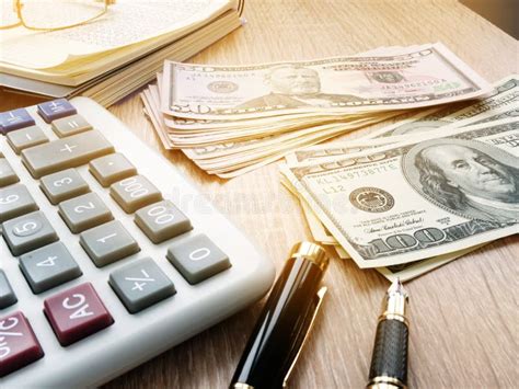 calculator dollar bills  accounting book   table stock image image  dual exchange