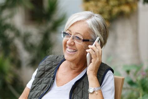 cheerful senior woman talking on mobile phone elderly lady enjoying