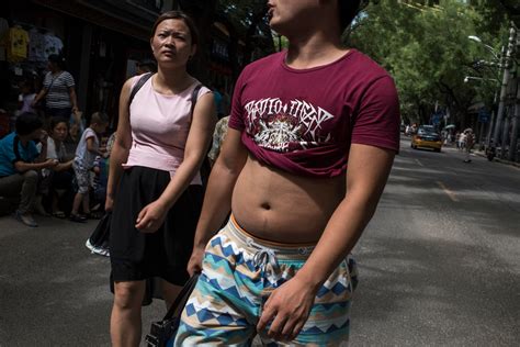 how some chinese men meet summer s swelter with midriff bare and