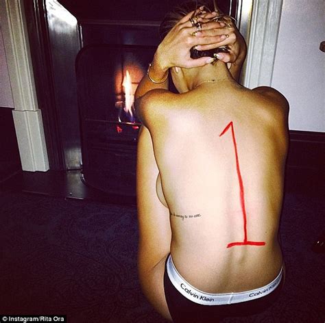 rita ora celebrates no 1 single by revealing side boob in topless snap daily mail online