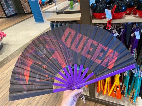 folding fans featuring dr facilier  evil queen   rainbow disneyland