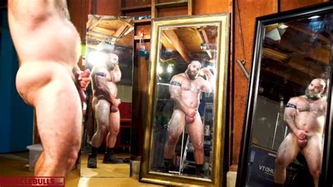 alpha muscle bull flexing stroking his cock in front of mirrors