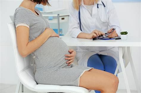 Pregnant Woman And Doctor With Laptop Stock Image Image Of Indoors