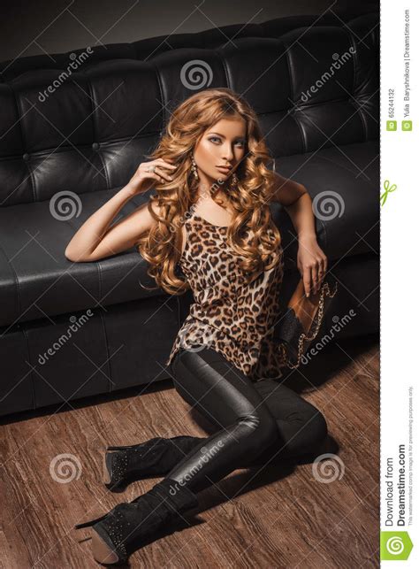 beautiful girl in high boots sitting on the floor royalty