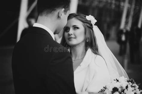 Gorgeous Happy Brunette Bride And Elegant Groom In Blue Suit Wit Stock