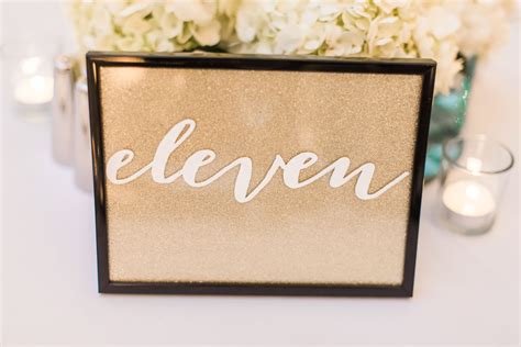 white calligraphy framed table numbers