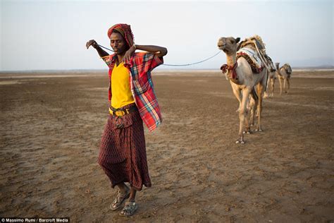 massimo rumi photographs ethiopians digging for salt in the gateway to