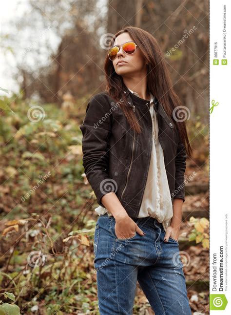 Outdoor Portrait Of Beautiful Female Model Posing Wearing