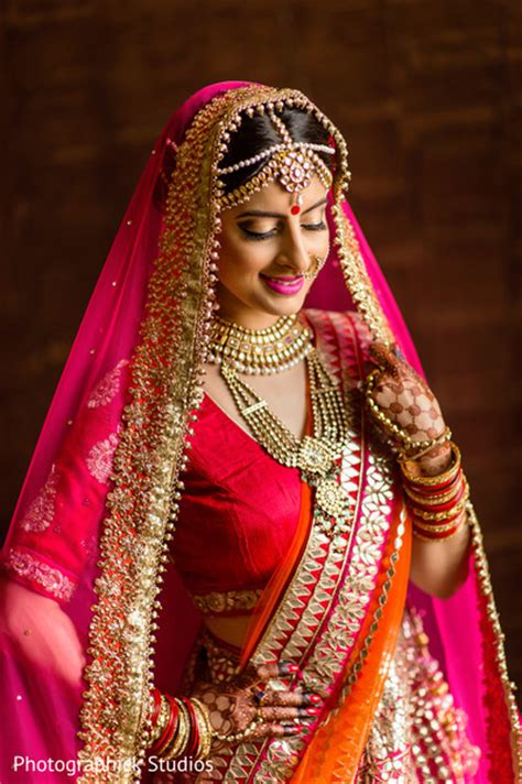 Lovely Indian Bride Posing In Her Hot Pink Wedding Attire