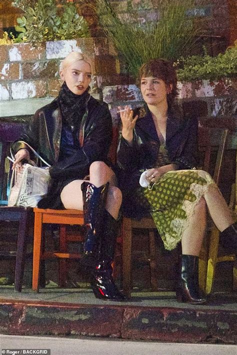 anya taylor joy rocks a leather look as she puffs on a cigarette after