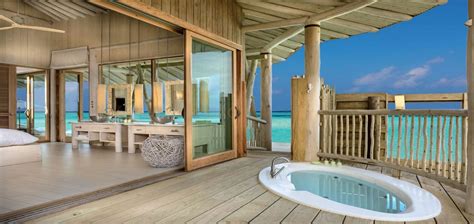 soneva jani four bedroom water reserve with slide bath maldives water