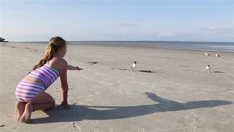 Pre Teen Girl Playing In Sand At Beach Stock Footage Video 13561307