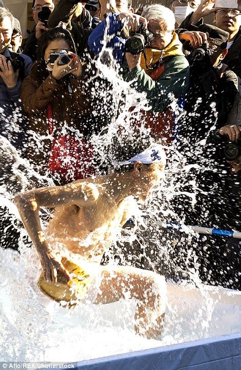 japanese bathers pour freezing water over themselves in new year