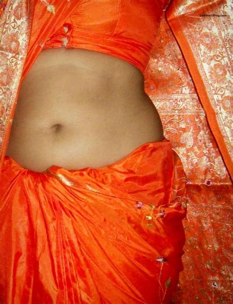 desi lady in orange saree blouse showing boob curves and navel pics 4