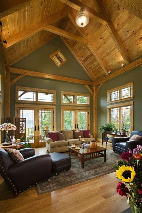 great room photo   pre designed woodhouse timber frame home sage green walls colorful