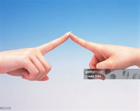 finger tips of two women touching each other foto stock getty images