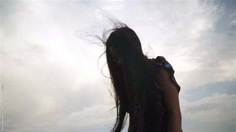 Beautiful Asian Woman Standing Next To The Sea Ocean Wind In Hair