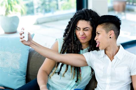 Lesbian Couple Taking A Selfie On Phone Stock Image Image Of Abode