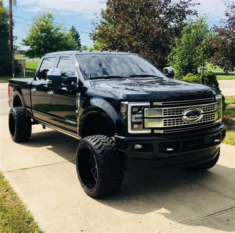 perfect blacked  lifted ford   platinum power stroke diesel ford pickup trucks