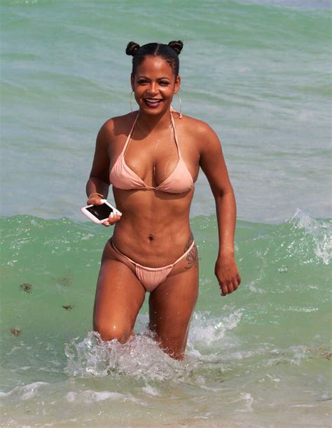 christina milian wears a pink bikini at the beach in miami