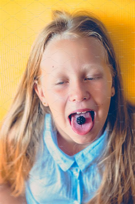 The Girl S Berry Lies On The Tongue People Images ~ Creative Market