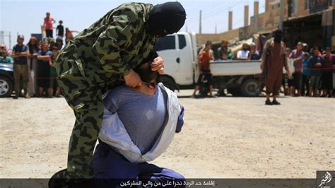 Graphic Photos Of Isis Beheading Men Accused Of Mocking Islam Serving