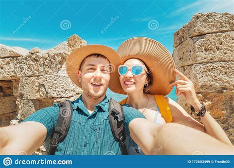 People In Love Hugging And Taking Selfie In Old Fortress With View To