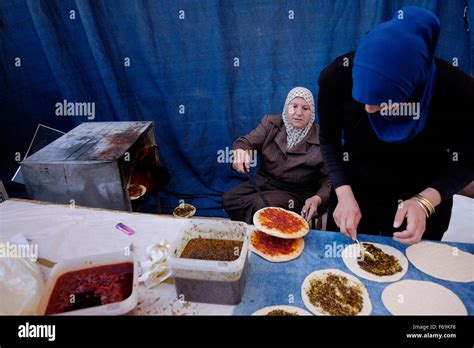 Arab Women Prepare Traditional Pita Bread Spread With Olive Oil And