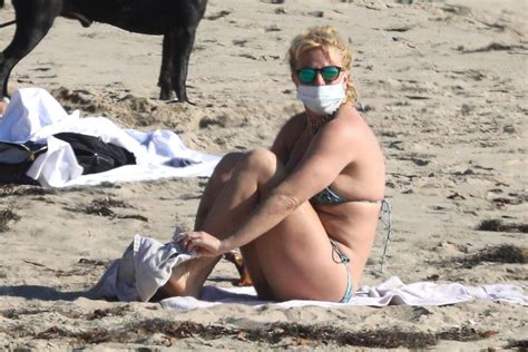 Britney Spears Sunbathing On The Beach In Malibu With Her Security