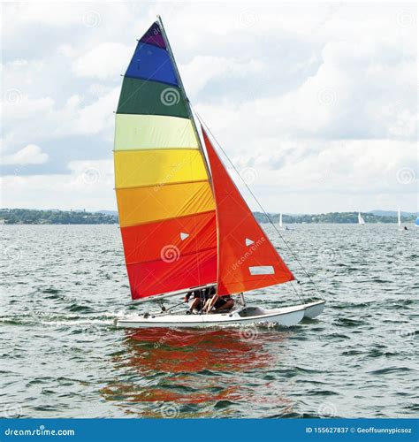 children sailing small sailboat boat   colourful sails