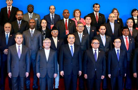 premier li keqiang stands with delegates at the 54th annual session of the asian african legal