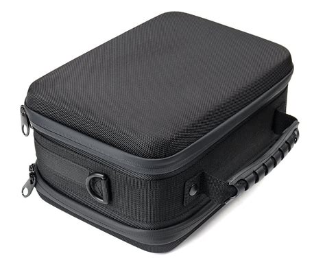 black suitcase sitting  top   white floor