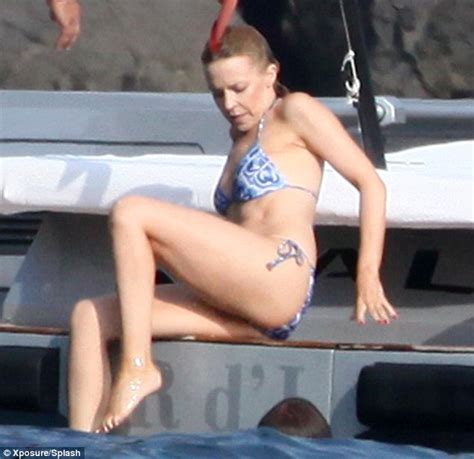 Kylie Minogue Displays Her Flat Stomach And Pert Posterior In Italy