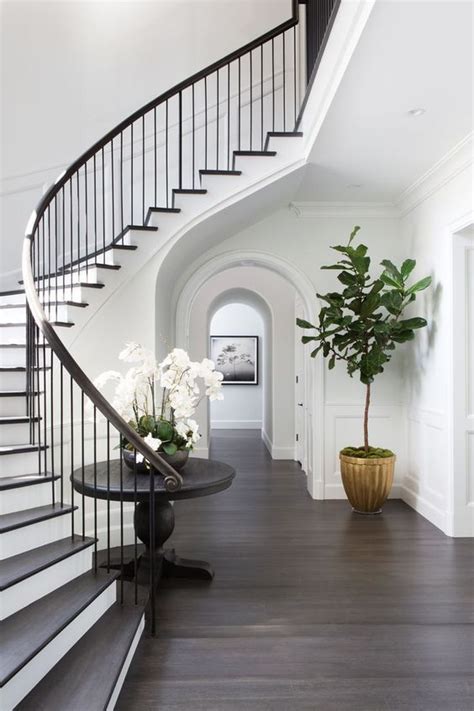 elegantly curved staircase  modern  simple black spindles