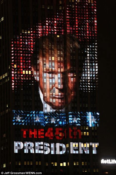 trump takes  manhattan skyline  empire state building displays picture   daily mail