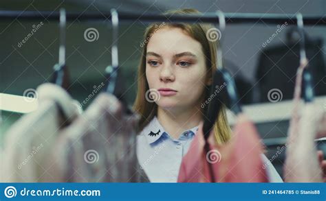 A Cute Girl Chooses Clothes In A Store Shopping Stock Image Image Of