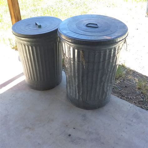 lot detail  metal garbage cans  lids