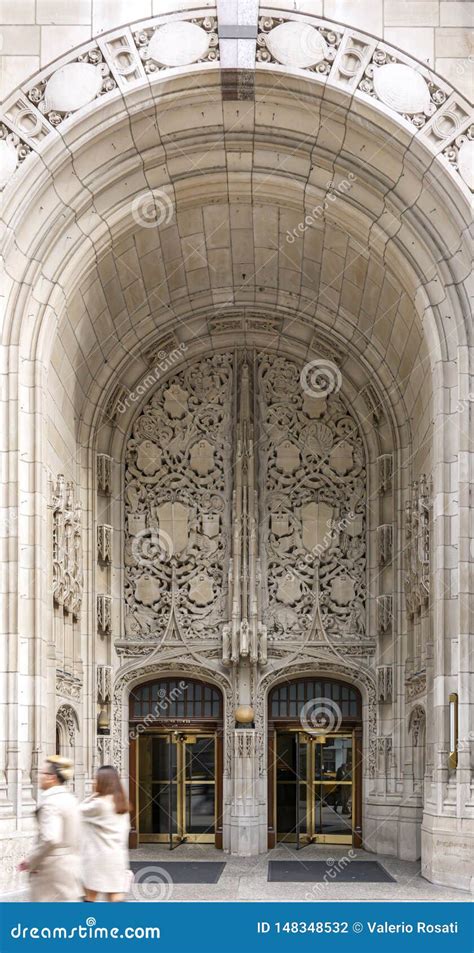 entrance   large decorated arch  revolving doors   tribune tower  chicago