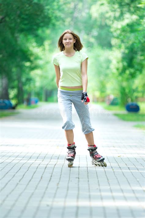 Roller Skating Sporty Girl In Park Rollerblading On Inline