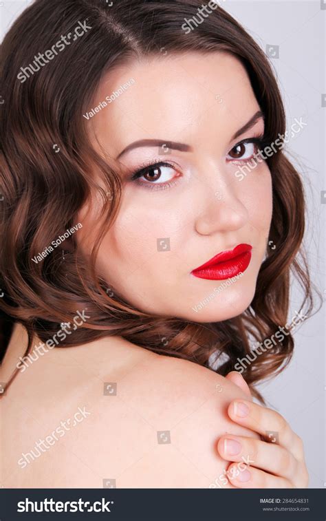 sexy beauty girl with red lips and nails provocative make