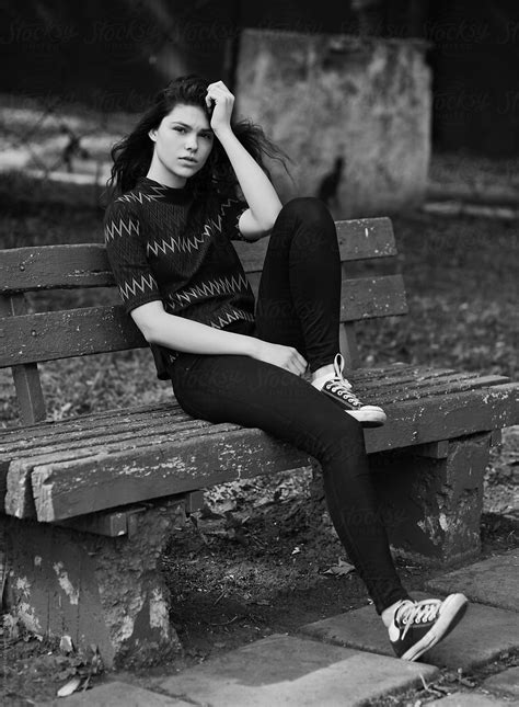 Sadly Teen Girl Sitting Alone On A Bench In The Park By Stocksy