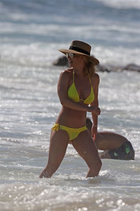 britney spears caught by paparazzi in yellow bikini