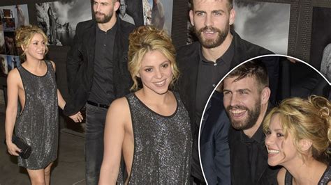 shakira sparkles as she ditches her bra and cosies up to partner gerard