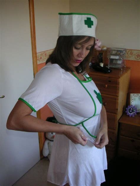 busty british milf demi dressed in a nurses uniform
