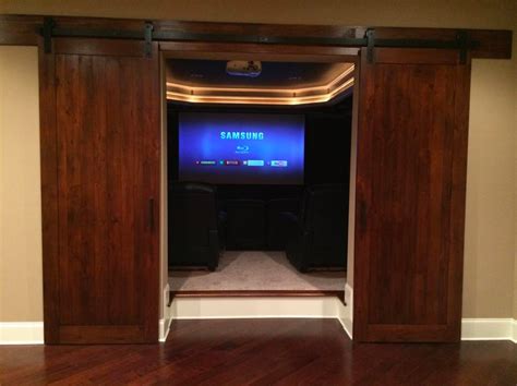 barn doors as a grand entrance into her indoor theater