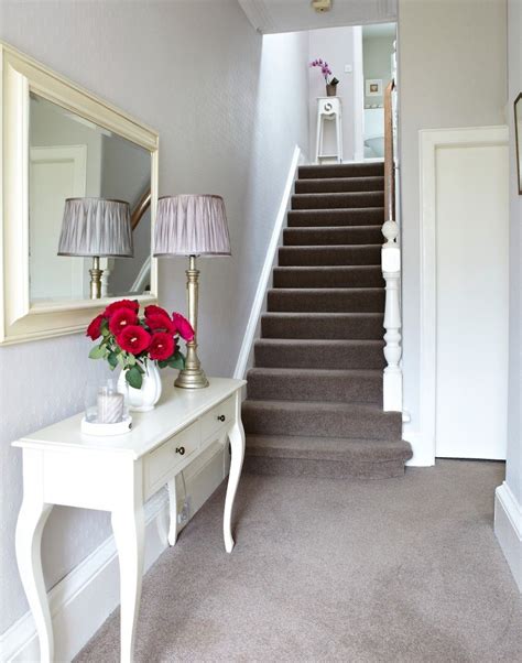 white traditional hallway  taupe carpet  french style console