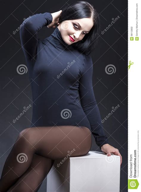 portrait of sensual tempting and smiling caucasian mature brunette