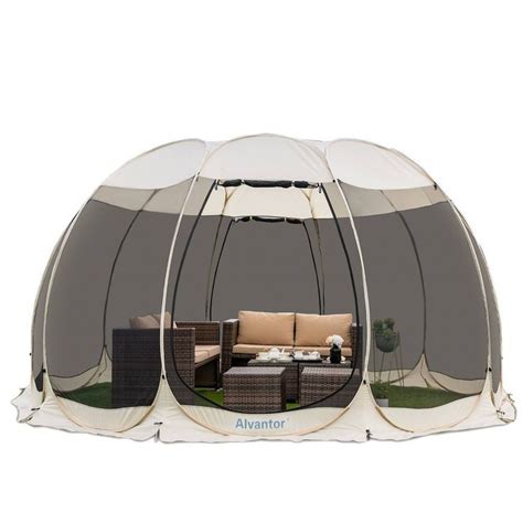large tent   set    grass  couches  tables